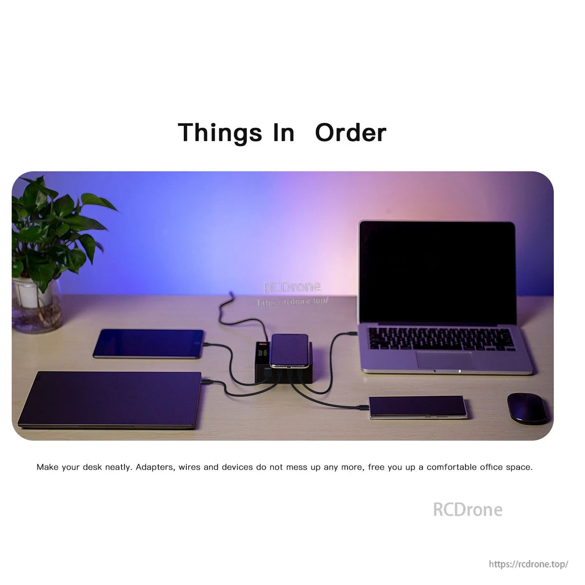 ISDT Power 200H USB-C Desktop Charger, USB-C desktop charger hub on a desk powering a laptop, phone, and other devices with multiple cables connected