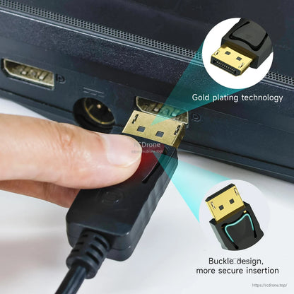 DisplayPort plug close-up showing gold-plated tip and latch buckle design while connecting to a device port