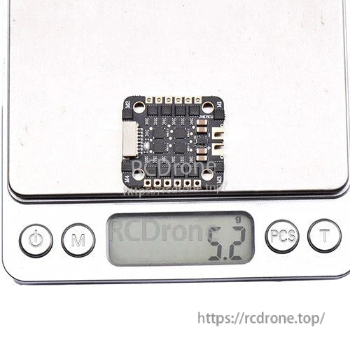 ESC board shown on digital scale displaying 5.2g weight