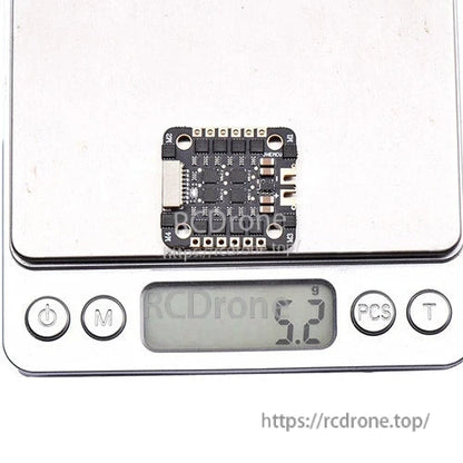 ESC board shown on digital scale displaying 5.2g weight