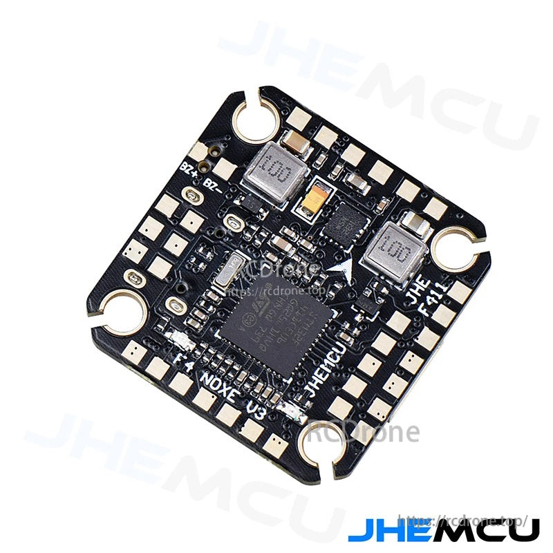 Angled view of the JHEMCU F411 NOXE V3 flight controller highlighting component layout and solder pad access
