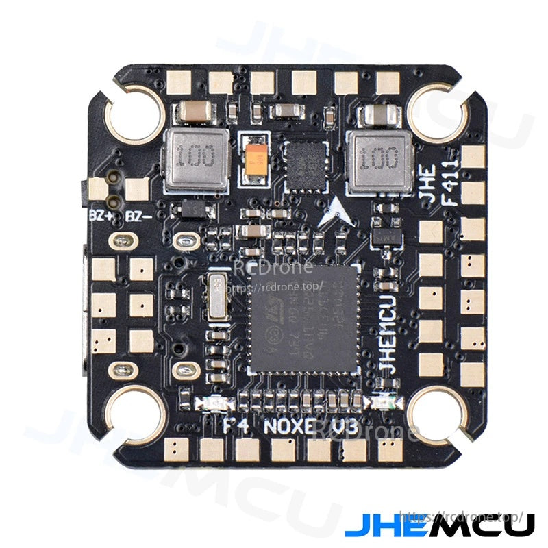 JHEMCU F4 NOXE V3 flight controller close-up showing STM32F411 chip, corner mounting holes, and labeled pads