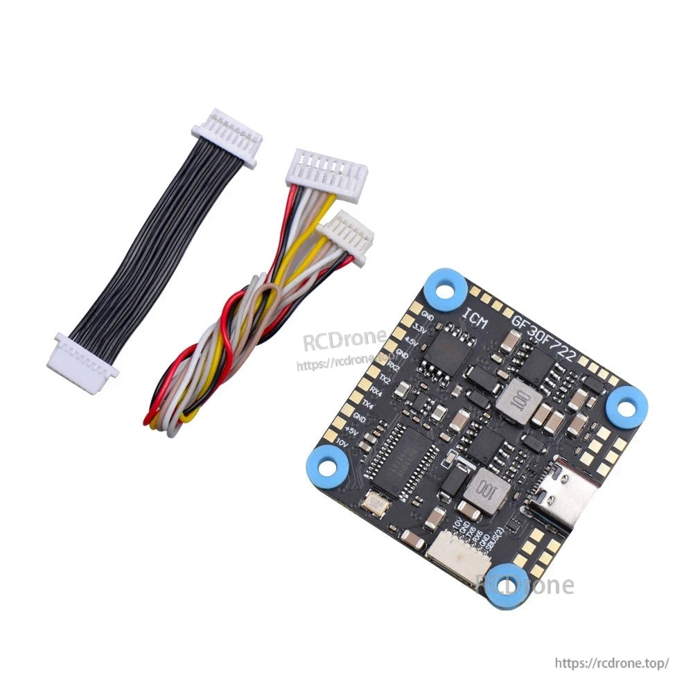 Flight controller kit with wiring harnesses and board showing USB-C port and backside components