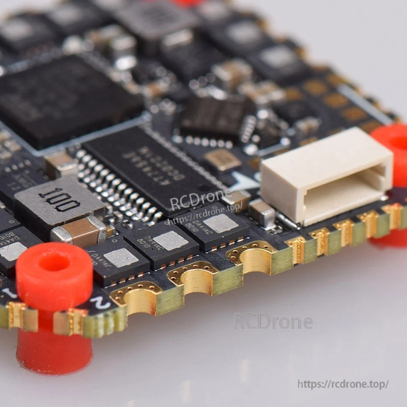 Close-up of JST connector and components on JHEMCU GHF745AIO AIO FC/ESC board, showing solder pads and edge cutouts