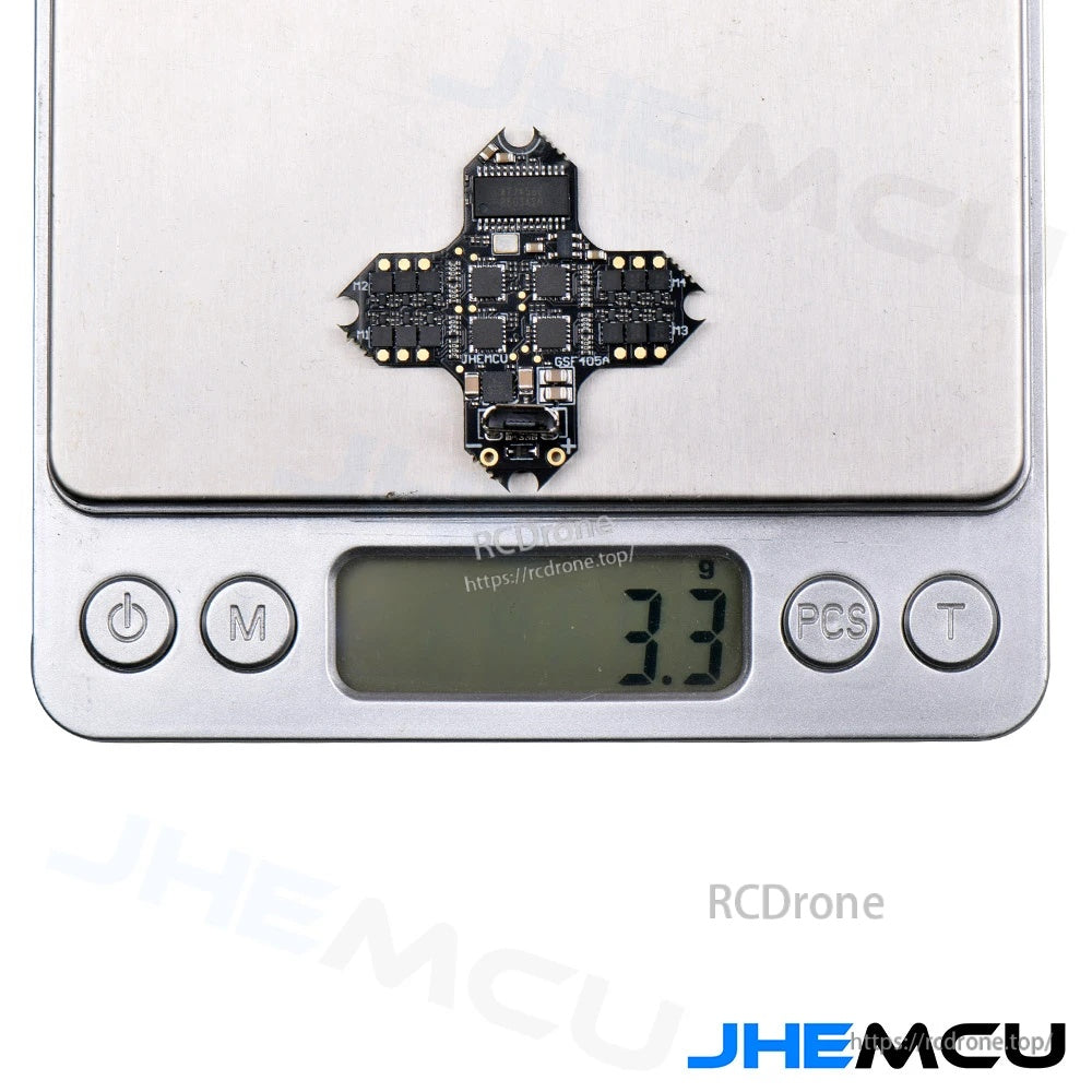 JHEMCU GSF405A-BMI AIO flight controller on a digital scale reading 3.3 g for lightweight micro FPV builds
