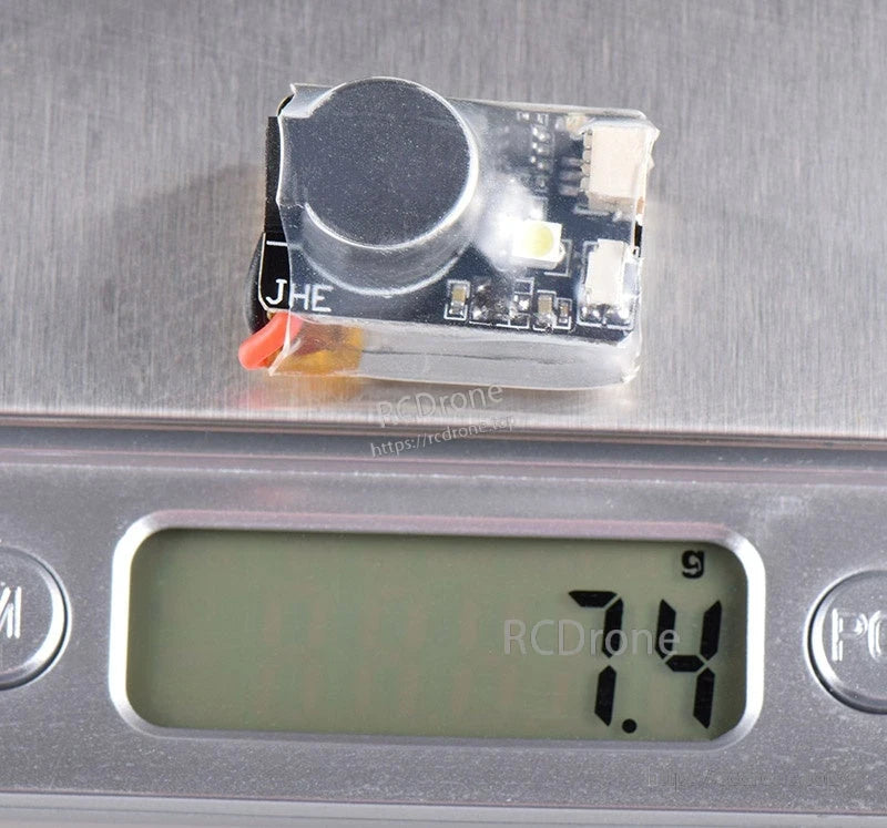 Finder BB buzzer alarm module on digital scale showing 7.4 g weight
