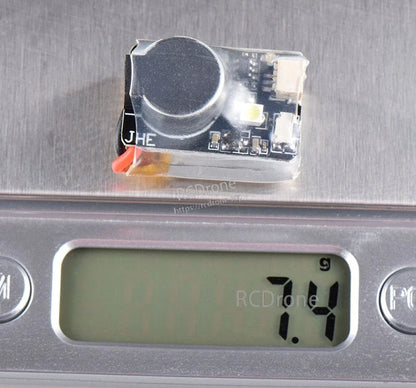 Finder BB buzzer alarm module on digital scale showing 7.4 g weight