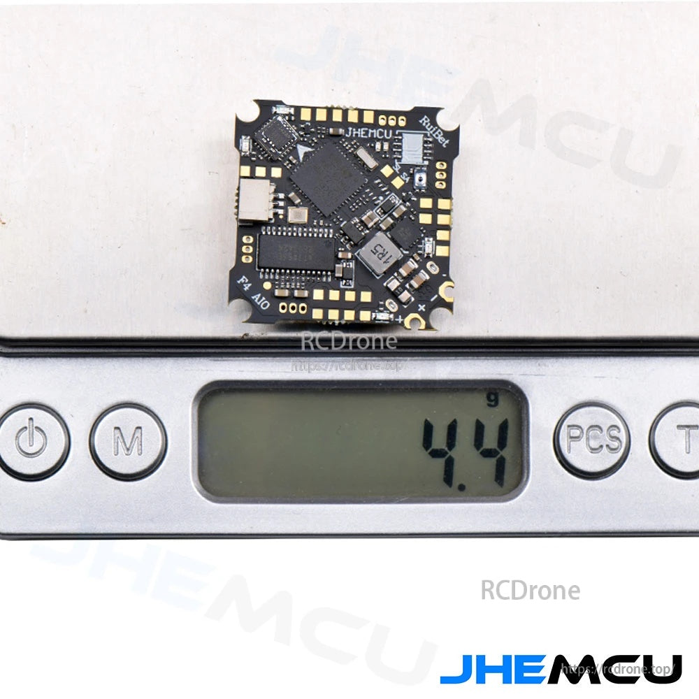 JHEMCU Ruibet F4AIO 12A AIO flight controller on scale showing 4.4g board weight