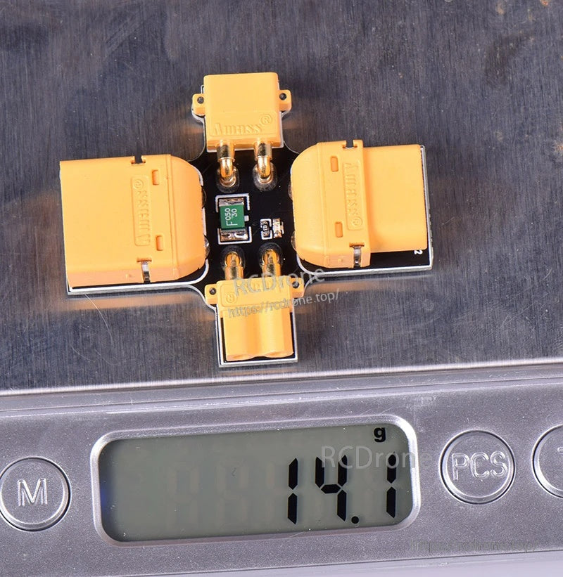 JHEMCU XT30/XT60 smoke stopper on a digital scale showing approximately 14.7 g weight