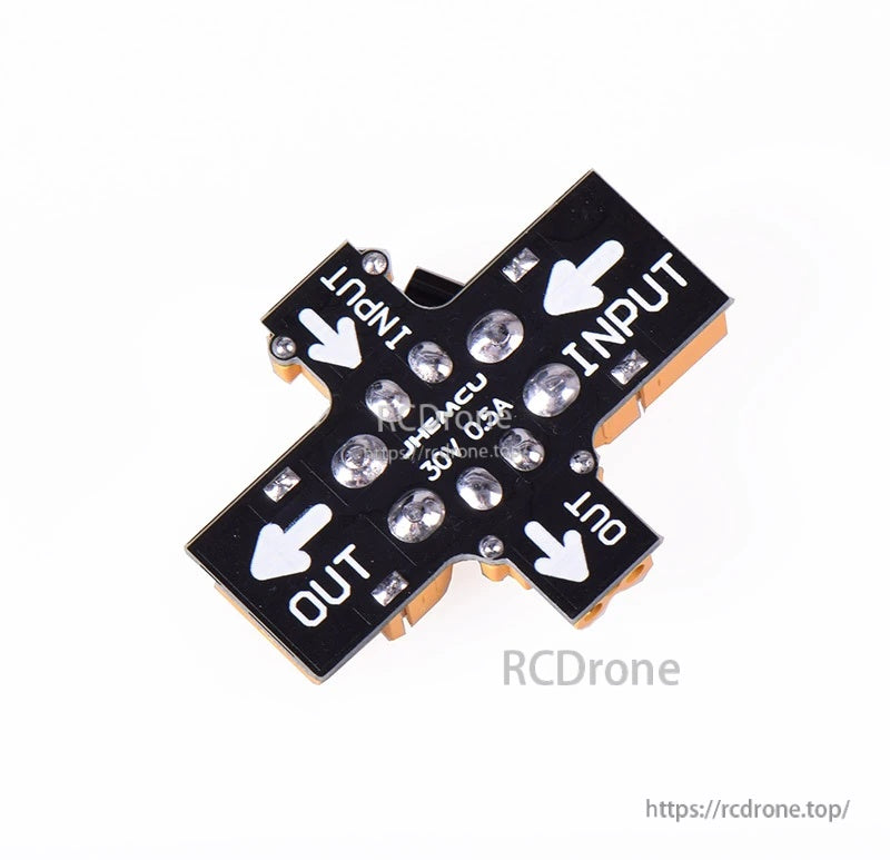 Top view of JHEMCU resettable fuse smoke stopper with large direction arrows labeled INPUT and OUT