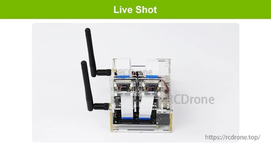 Top-down live shot of the transparent acrylic enclosure with antennas installed on a Jetson Nano setup