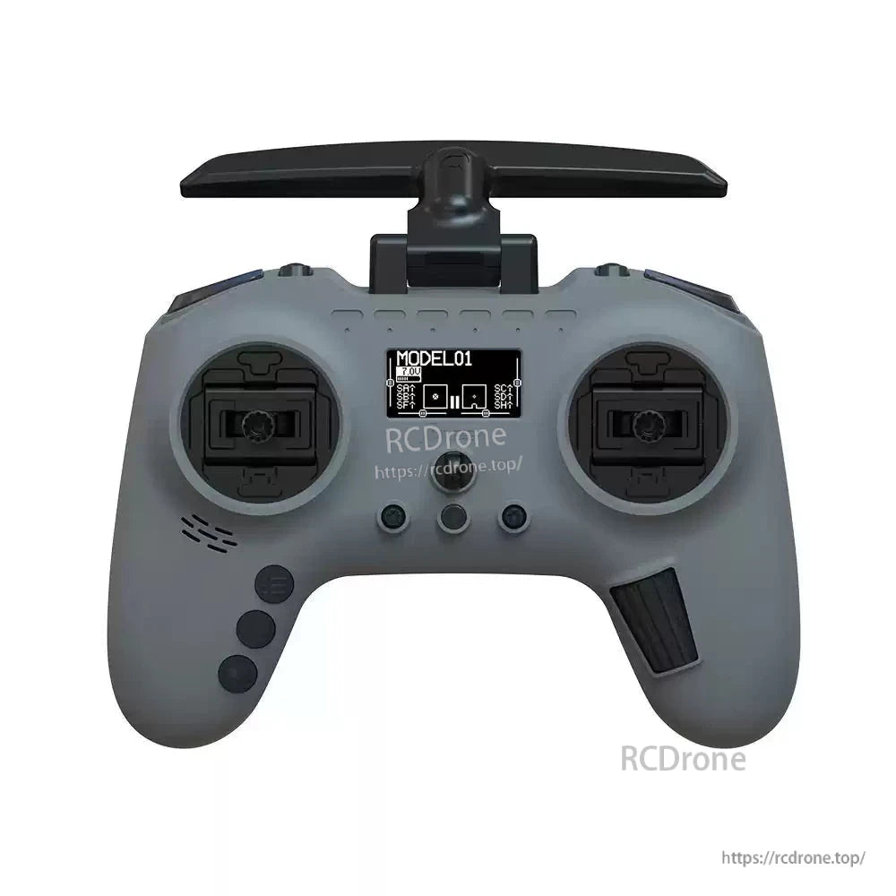 Gray radio controller with OLED screen, dual gimbals, and antenna mount.