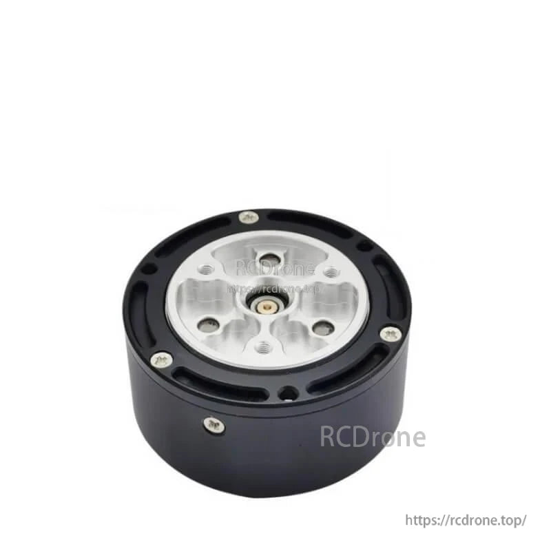 Output side of motor reducer showing silver mounting plate, center shaft bore, and perimeter screw holes
