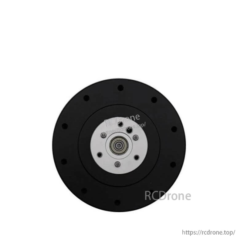 Front-on view of motor output flange with bolt pattern and centered shaft bearing