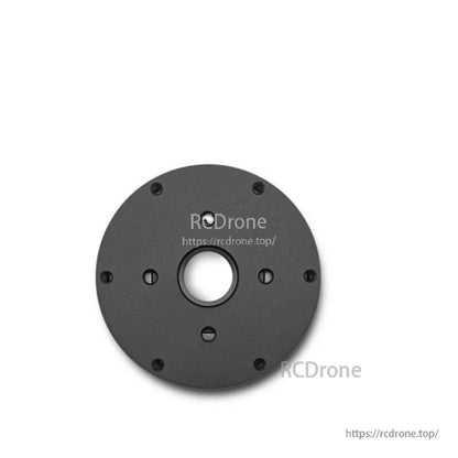 Rear face of motor with center shaft hole and mounting screw pattern, unlabeled side