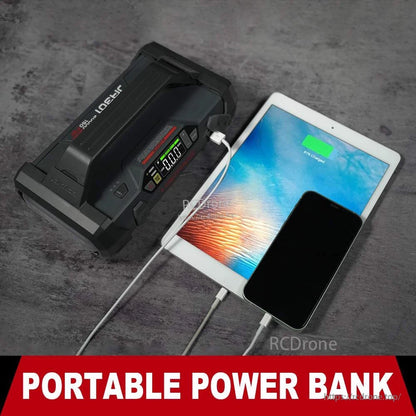 LOKITHOR JA301 portable jump starter power bank charging a tablet and smartphone via USB with LCD display