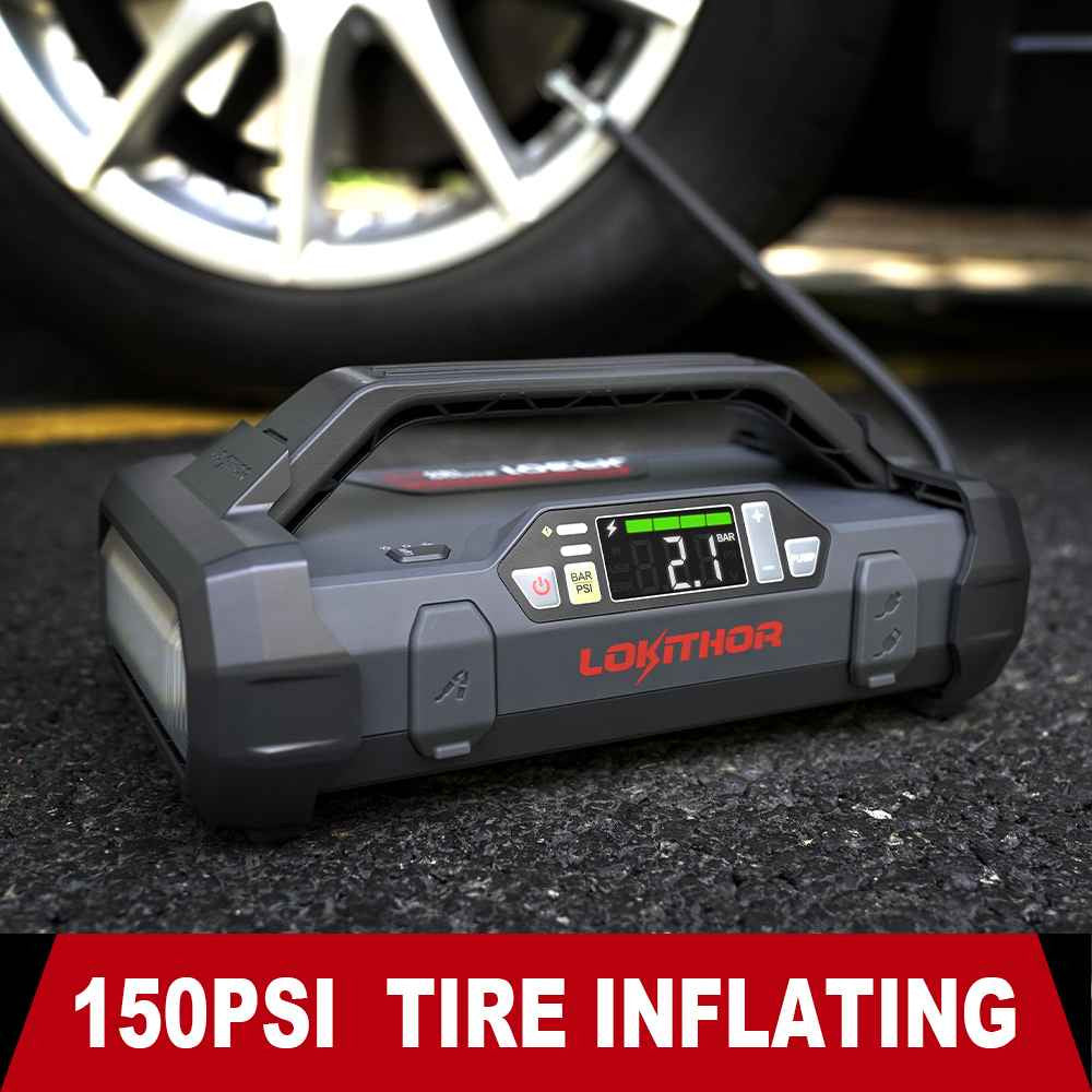 LOKITHOR JA301 portable jump starter with built-in 150 PSI air inflator, digital pressure display by a car tire
