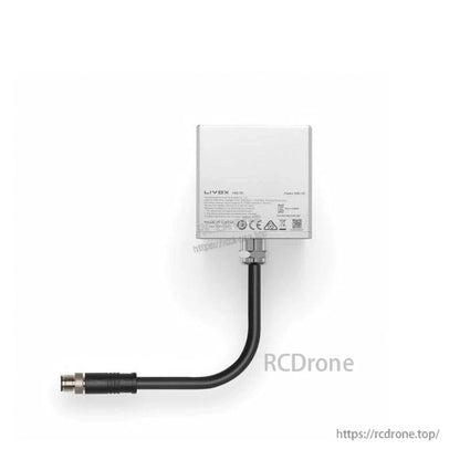 Rear view with product label, compliance icons, and attached cable with circular connector