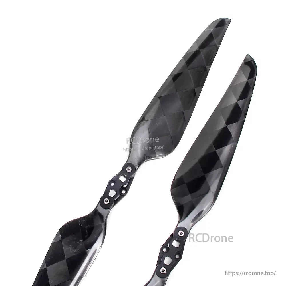Glossy carbon fiber folding propeller blades with metal hub hardware, black checkered weave finish