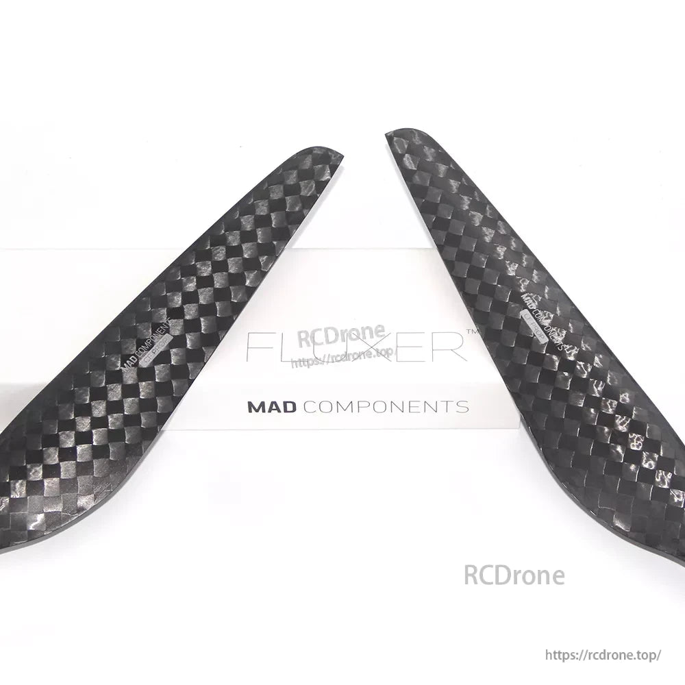 Pair of MAD FLUXER 28x8.4 carbon fiber propeller blades with woven finish for counter-rotating setup