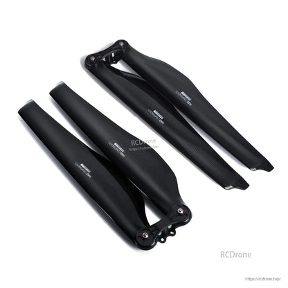 Pair of glossy carbon fiber folding propeller blades with hub mounts, MAD FLUXER Pro for RC drone