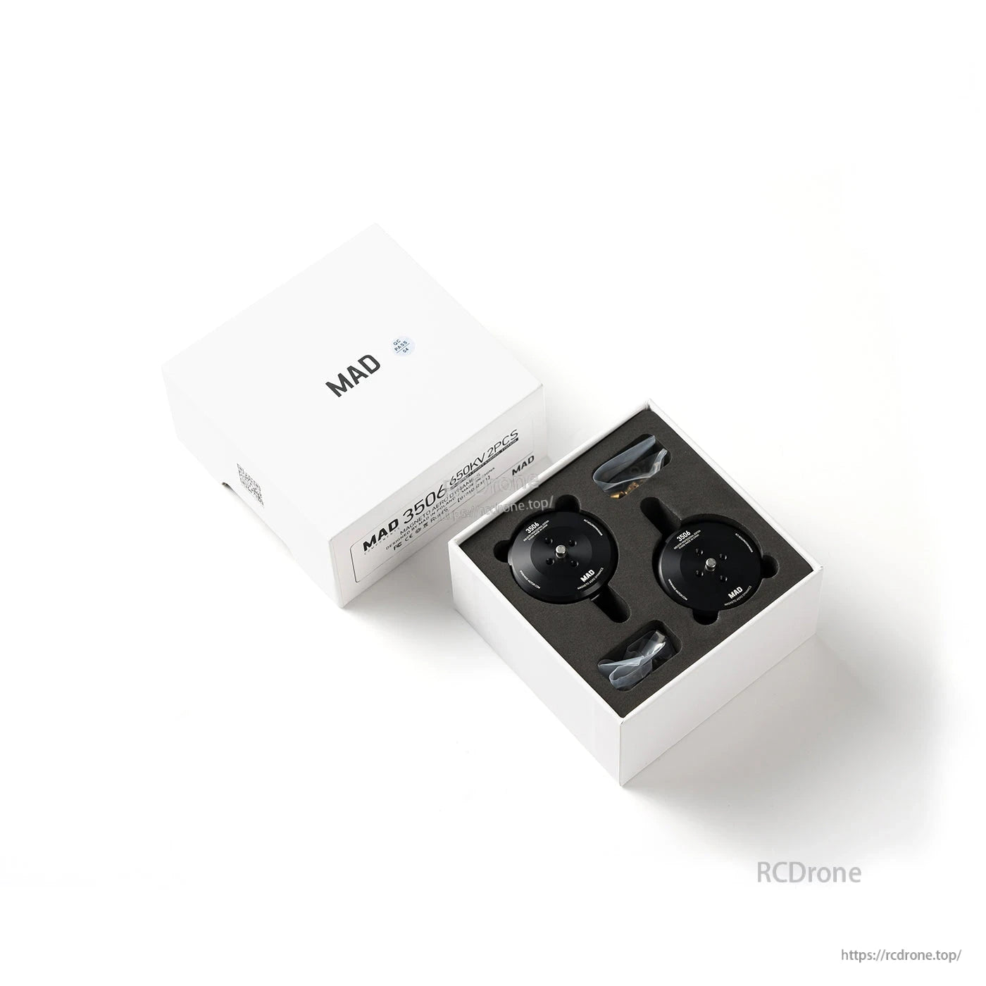MAD 3506 IPE V1.0 drone motor set in a white box with two black motors and included screws in foam insert