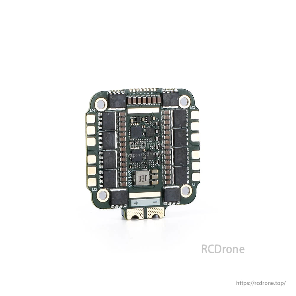 MAD AM32 100A 3-12S 4in1 ESC, Top view of MAD AM32 100A 3-12S 4-in-1 ESC board with motor outputs (M1–M4) and +/− battery pads