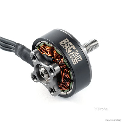 MAD BSC 2407 FPV drone motor with visible copper windings, four-bolt mount pattern, and threaded shaft