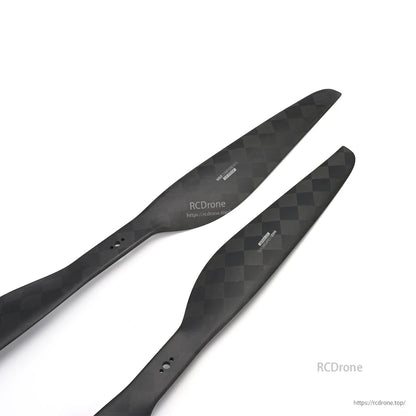 Pair of MAD CB2 PRO 15x5.0 carbon fiber propeller blades with checker weave and mounting holes