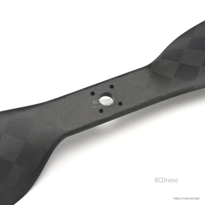MAD CB2 PRO 27x8.8in Carbon Fiber Propeller, Close-up of MAD CB2 PRO carbon fiber propeller hub with multi-hole mounting pattern and matte weave finish