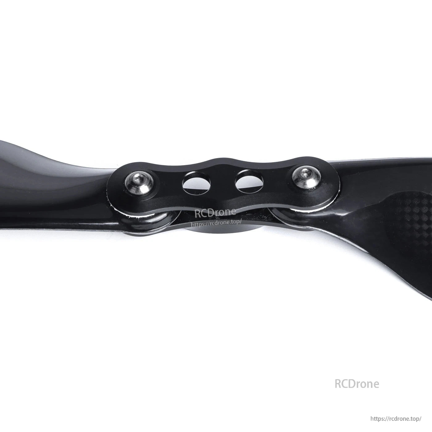 Close-up of MAD Components FLUXER Pro glossy carbon fiber folding propeller hub with bolts and two blades
