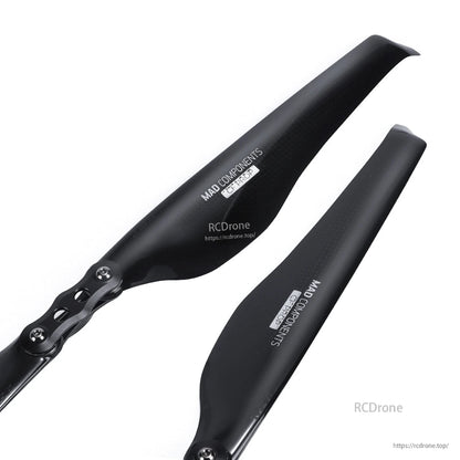 MAD Components carbon fiber folding propeller blades with glossy black finish and metal hinge hub
