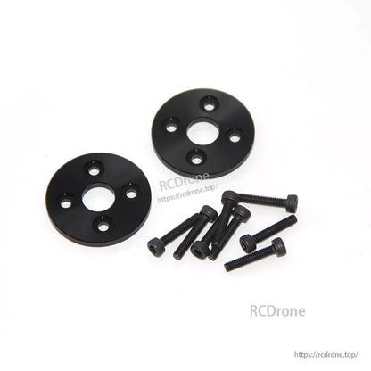 MAD FLUXER 28x9.2 Carbon Fiber Propeller, Two black round propeller mounting hub plates with multiple bolt holes and a set of hex screws
