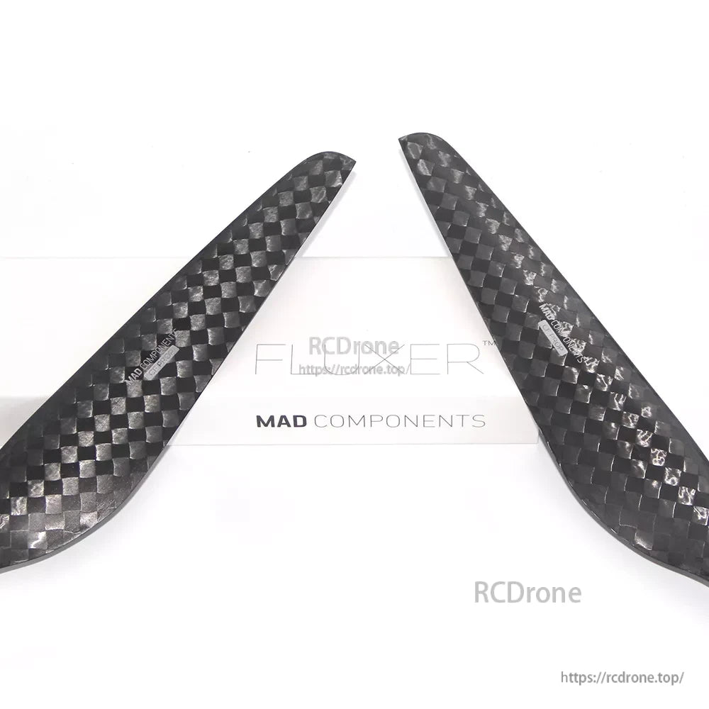 MAD FLUXER 28x9.2 Carbon Fiber Propeller, Pair of MAD FLUXER carbon fiber propeller blades with a glossy checkerboard weave finish