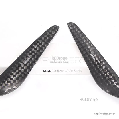 MAD FLUXER 28x9.2 Carbon Fiber Propeller, Pair of MAD FLUXER carbon fiber propeller blades with a glossy checkerboard weave finish