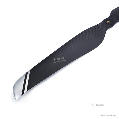 MAD FLUXER CB2 57x19 inch Carbon Fiber Propeller, MAD FLUXER CB2 carbon fiber propeller blade with striped tip and mounting holes on a white background