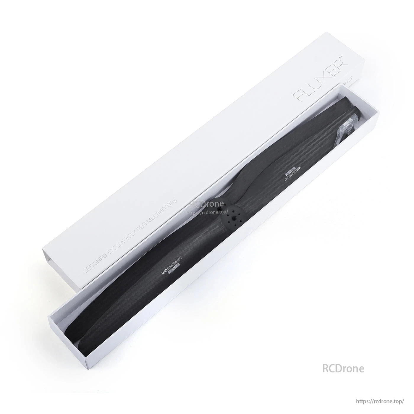 MAD FLUXER eVTOL carbon fiber propeller in a white FLUXER box, black blade with visible weave finish