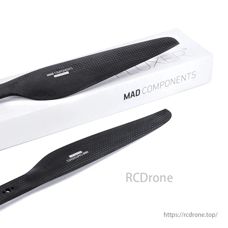 Black carbon fiber propellers by MAD COMPONENTS and FLUXER, in a white branded box.
