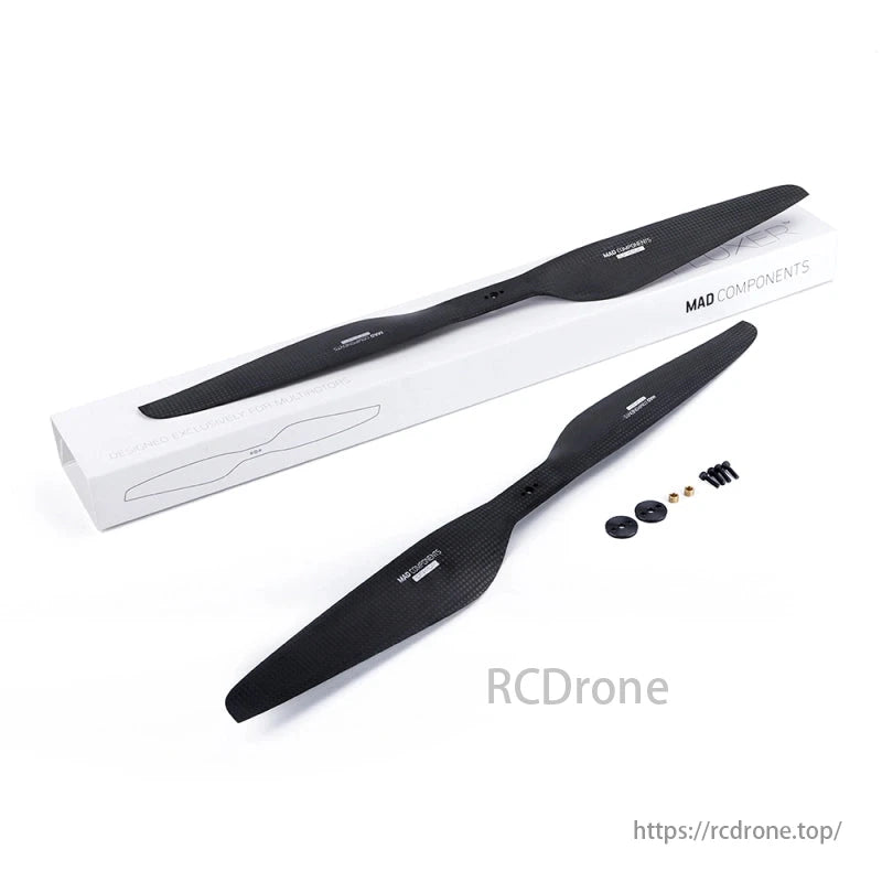Two black carbon fiber propellers with mounting hardware, labeled "MAD COMPONENTS," are shown with their packaging.