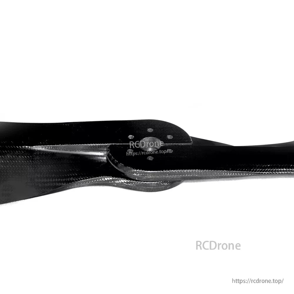 Close-up of MAD FLUXER PRO 60-inch carbon fiber paramotor propeller with central hub and mounting holes