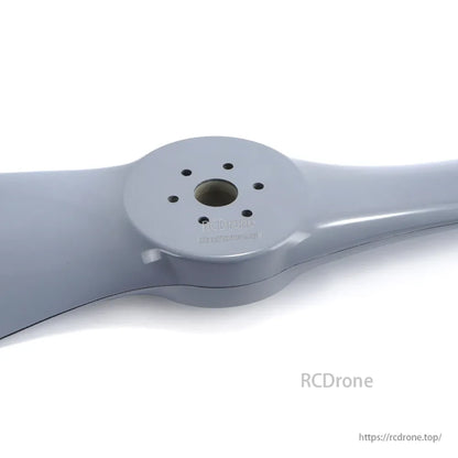 Two-blade paramotor propeller with a gray finish, centered hub and multiple mounting holes