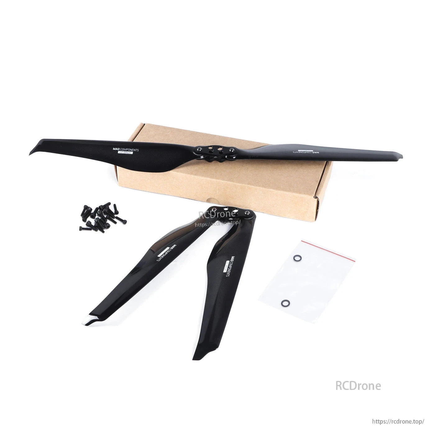 MAD FLUXER Pro glossy carbon fiber folding propeller set with hub, blades, screws, and hardware