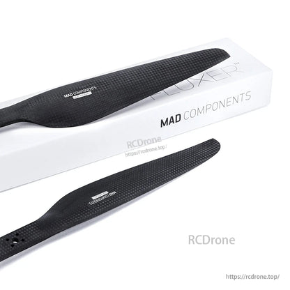 MAD Components carbon fiber drone propeller pair (CW/CCW) with textured black blades and branded box