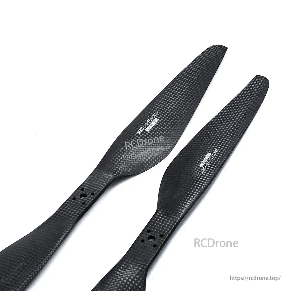 Pair of 30x10 carbon fiber propeller blades with woven finish and multi-hole mounting hub