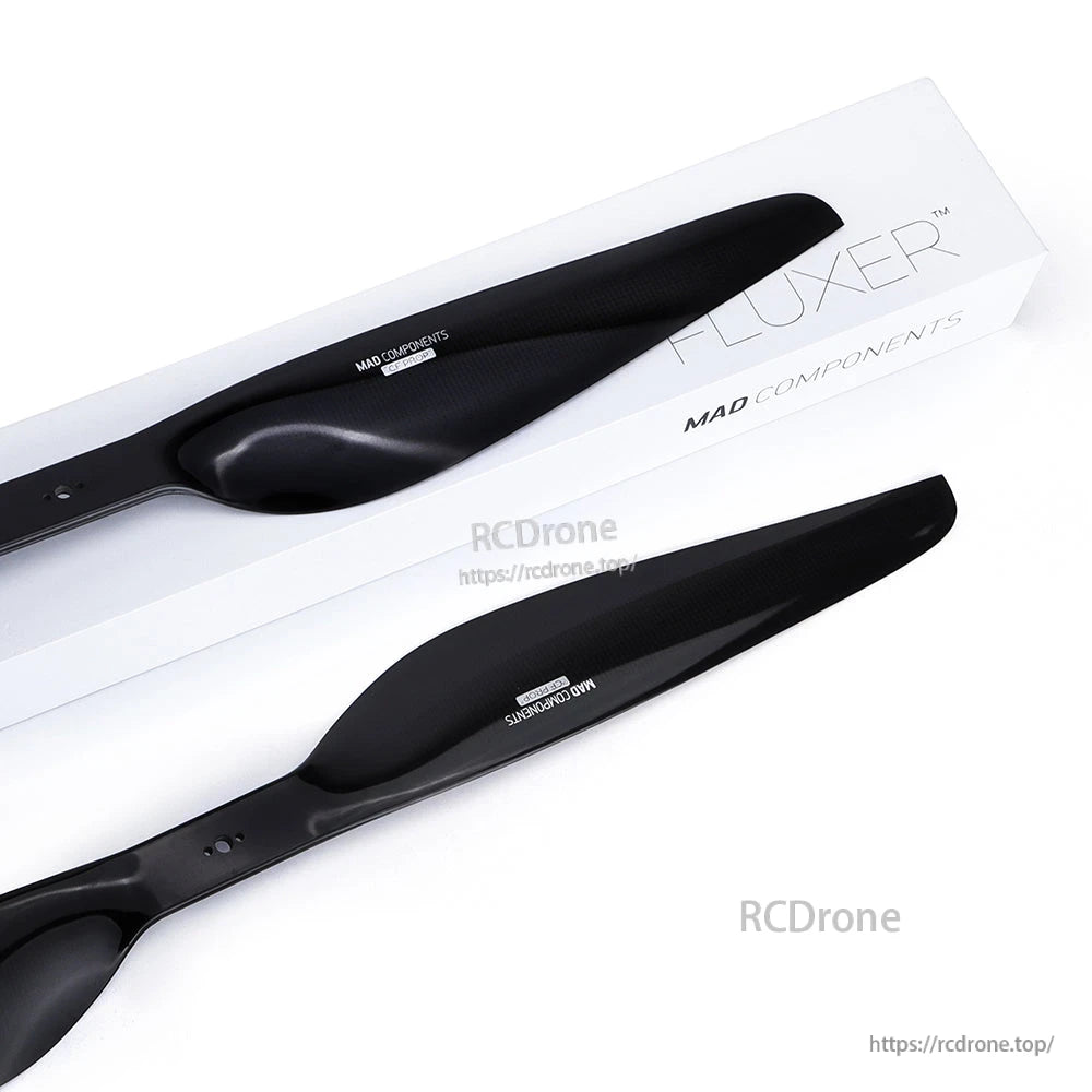 Black MAD FLUXER Pro Shine drone propeller blades with glossy finish on FLUXER MAD Components packaging