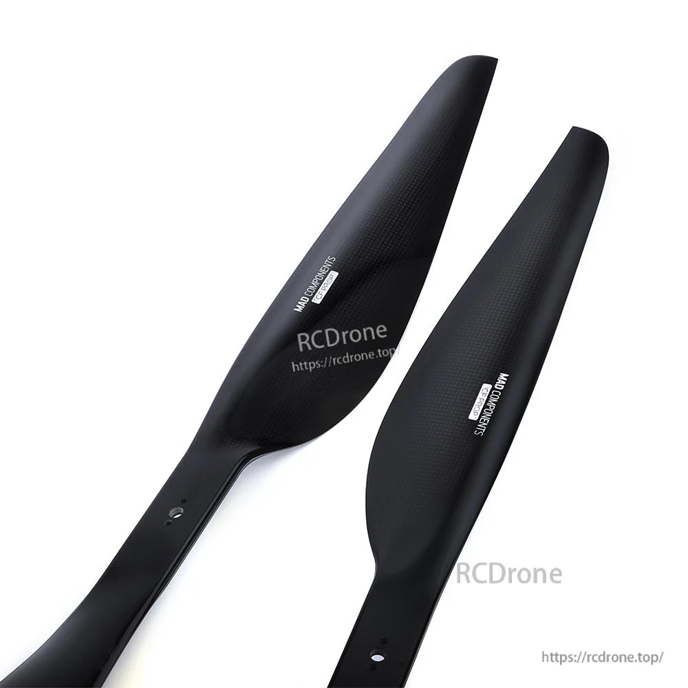 Pair of black MAD FLUXER Pro Shine drone propeller blades with glossy finish and mounting holes
