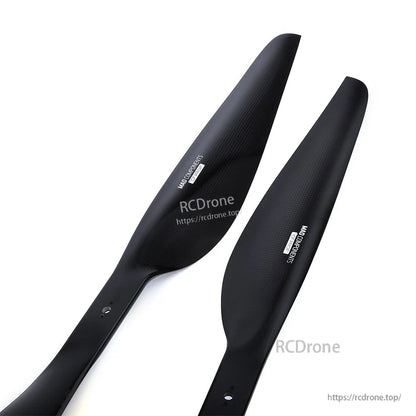 Pair of black MAD FLUXER Pro Shine drone propeller blades with glossy finish and mounting holes