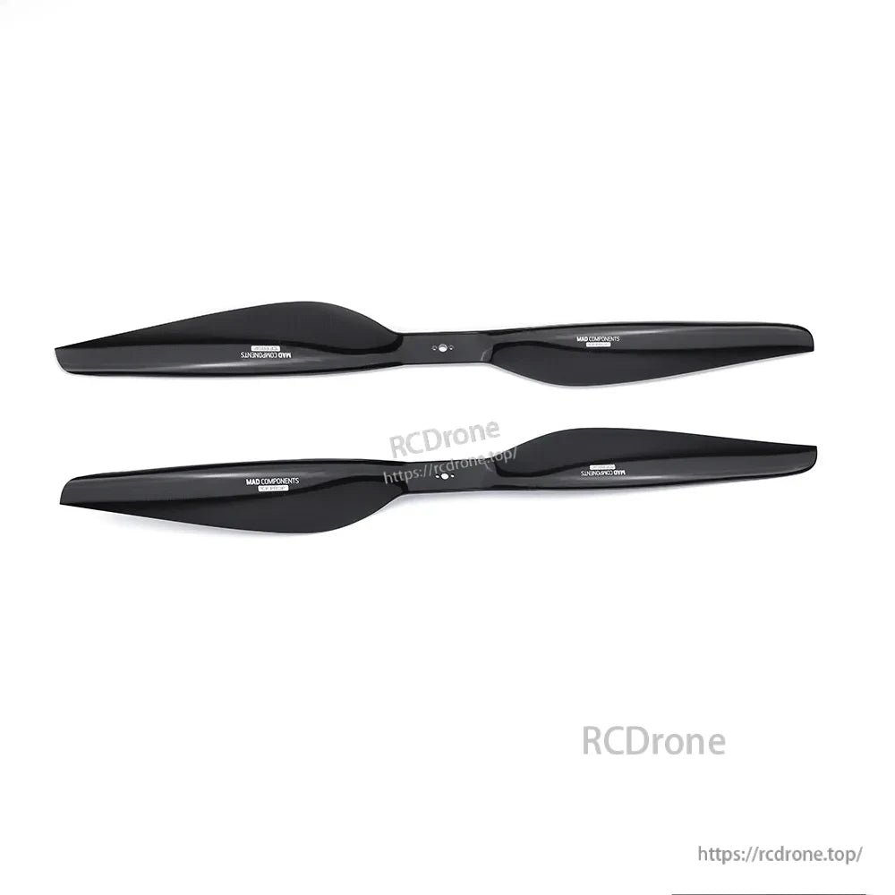Pair of MAD FLUXER Pro Shine glossy black carbon fiber drone propellers on white background