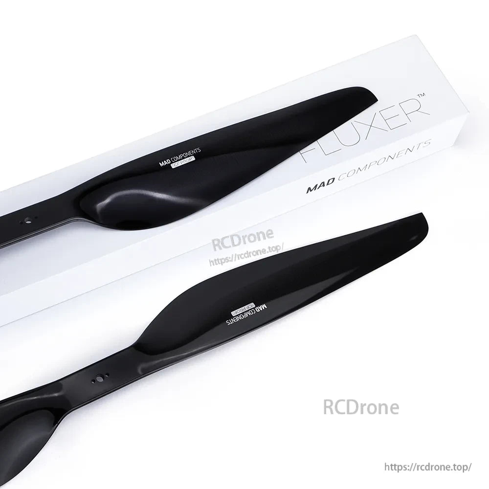 Pair of MAD FLUXER Pro drone propeller blades in glossy black finish with FLUXER branded packaging
