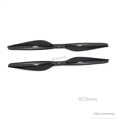 Pair of glossy black carbon fiber drone propeller blades from the MAD FLUXER Pro Shine kit